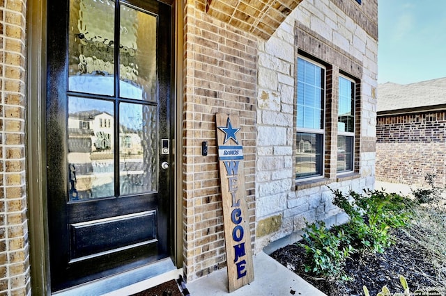 entrance to property with brick siding