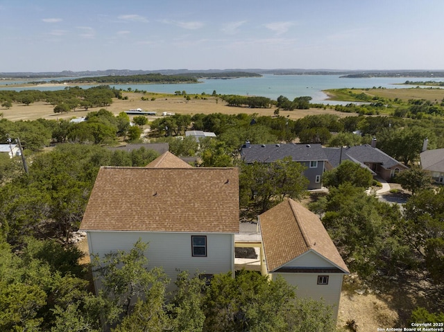 bird's eye view featuring a residential view and a water view