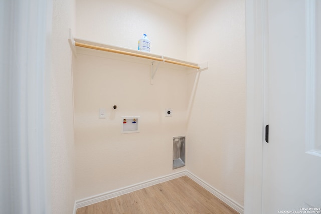 laundry room featuring washer hookup, hookup for an electric dryer, wood finished floors, laundry area, and baseboards