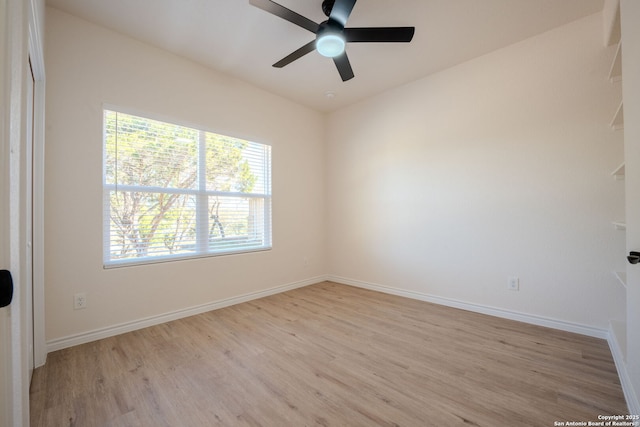 unfurnished room with light wood-style floors, ceiling fan, and baseboards