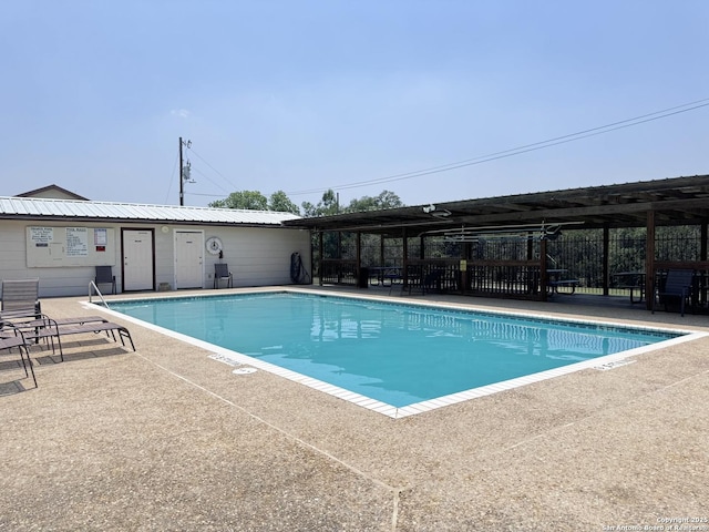 pool featuring a patio area and fence