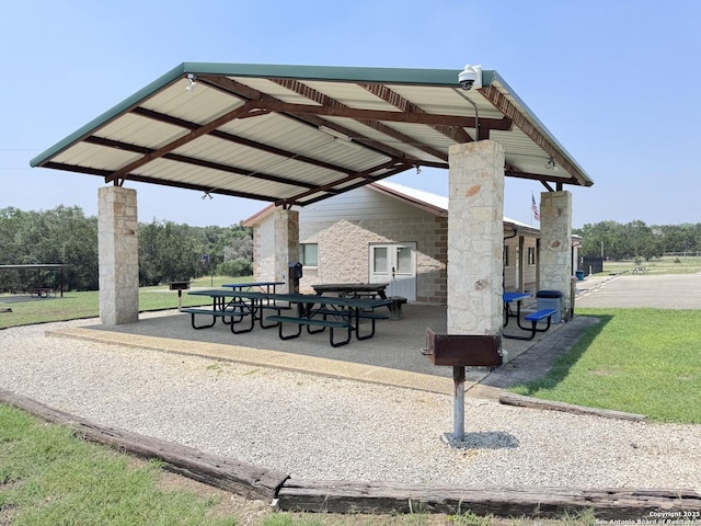 surrounding community featuring a patio area, a lawn, and a gazebo