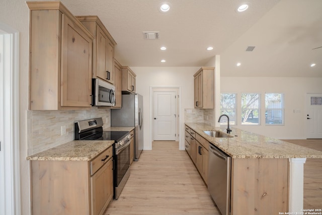 kitchen with visible vents, light brown cabinets, appliances with stainless steel finishes, and a sink