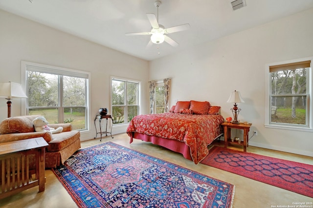 bedroom featuring multiple windows, visible vents, and a ceiling fan