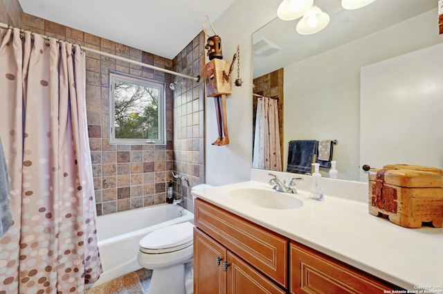 full bathroom featuring toilet, visible vents, shower / bath combination with curtain, and vanity