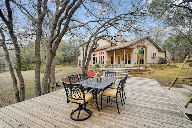 deck featuring outdoor dining space