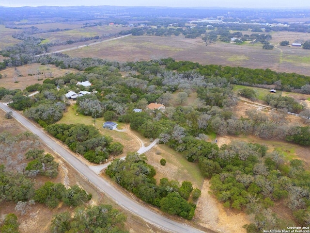 birds eye view of property featuring a rural view