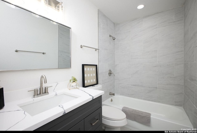 bathroom featuring recessed lighting, shower / bath combination, vanity, and toilet