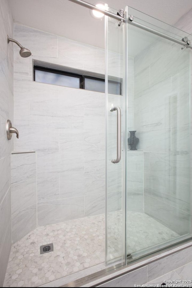 full bathroom with a stall shower