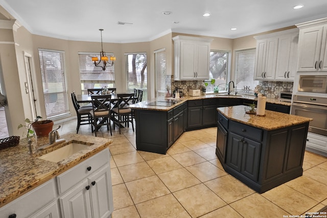 4114 Luckenbach, San Antonio, TX 78251 - kitchen featuring a kitchen island, white cabinetry, a sink, and oven
