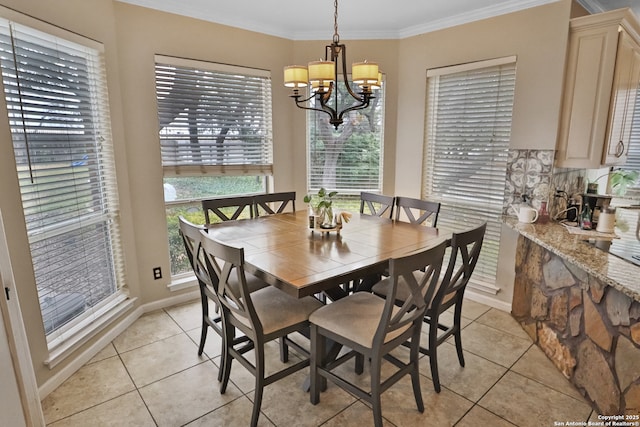 4114 Luckenbach, San Antonio, TX 78251 - dining area with an inviting chandelier, baseboards, crown molding, and light tile patterned flooring
