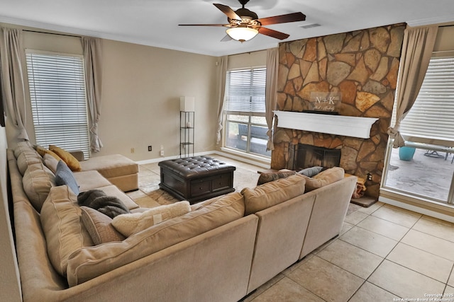 4114 Luckenbach, San Antonio, TX 78251 - living area with light tile patterned flooring, a fireplace, visible vents, a ceiling fan, and crown molding