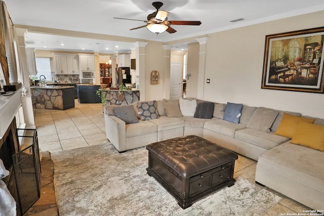 4114 Luckenbach, San Antonio, TX 78251 - living area featuring ornamental molding, visible vents, ceiling fan, and light tile patterned floors