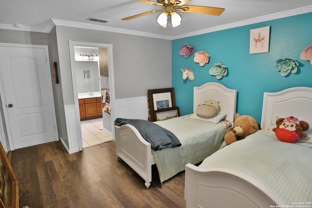 4114 Luckenbach, San Antonio, TX 78251 - bedroom featuring ceiling fan, connected bathroom, dark wood-style flooring, visible vents, and ornamental molding