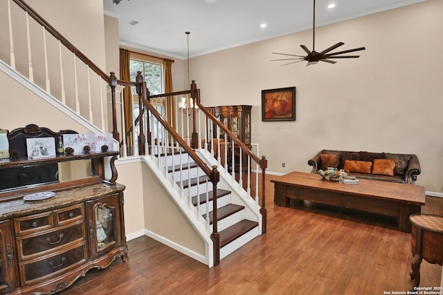 4114 Luckenbach, San Antonio, TX 78251 - stairs featuring baseboards, wood finished floors, crown molding, a notable chandelier, and recessed lighting