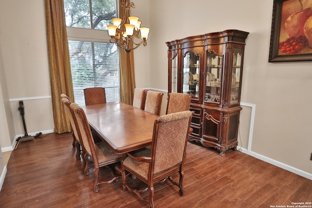 4114 Luckenbach, San Antonio, TX 78251 - dining space with a chandelier, baseboards, and wood finished floors