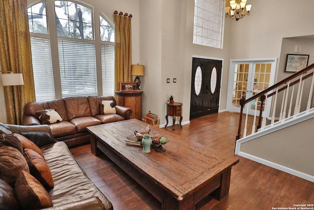 4114 Luckenbach, San Antonio, TX 78251 - living area featuring an inviting chandelier, stairs, a high ceiling, and dark wood-style flooring