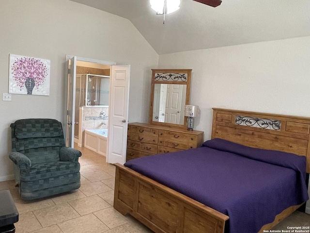 bedroom with vaulted ceiling, light tile patterned floors, connected bathroom, and a ceiling fan