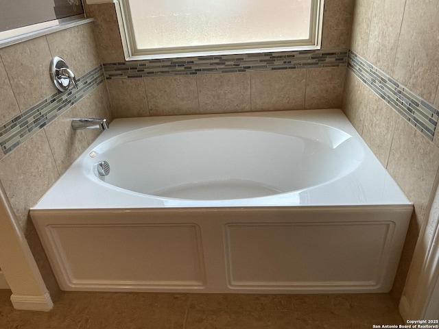 bathroom with a garden tub