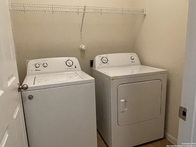 clothes washing area featuring laundry area and washer and dryer