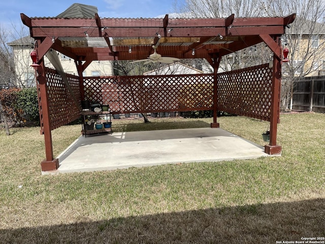 view of patio / terrace featuring fence and ceiling fan