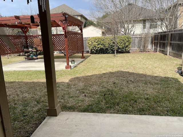 view of yard featuring a fenced backyard, a patio, and a pergola