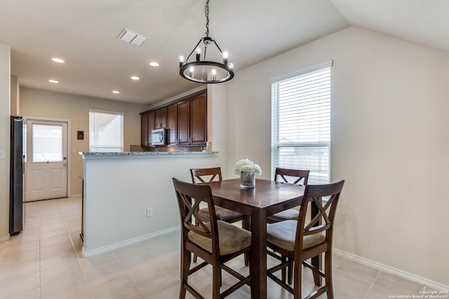 dining room featuring recessed lighting, baseboards, visible vents, vaulted ceiling, and light tile patterned flooring