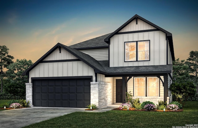 modern farmhouse style home featuring a garage, a shingled roof, driveway, stone siding, and board and batten siding