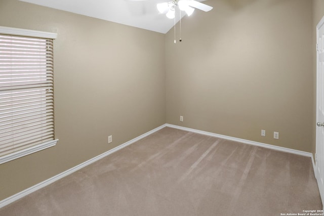 unfurnished room featuring light carpet, ceiling fan, and baseboards