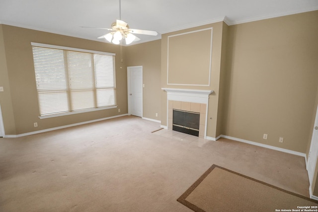 unfurnished living room featuring baseboards, crown molding, light carpet, and a tiled fireplace