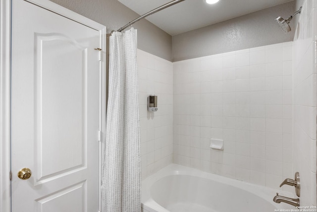 bathroom with shower / bathtub combination with curtain