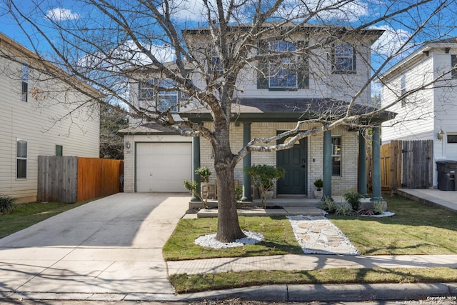 view of front of home with a front yard, fence, concrete driveway, and brick siding