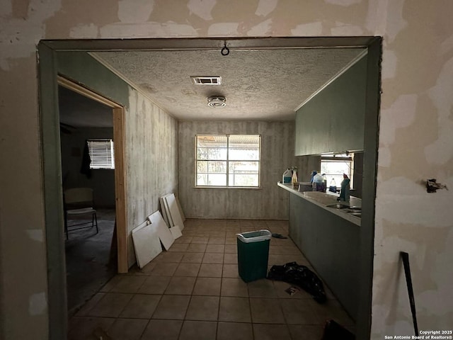 204 Dogwood Ln, Kountze, TX 77625 - interior space with a textured ceiling, visible vents, and tile patterned floors