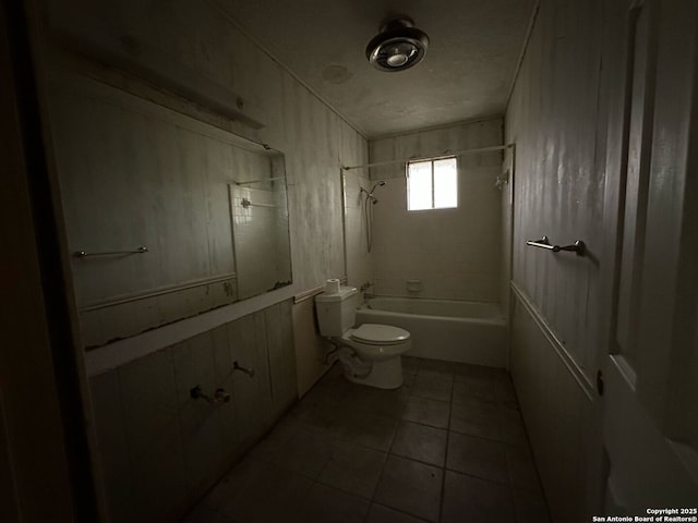 204 Dogwood Ln, Kountze, TX 77625 - bathroom with bathing tub / shower combination, toilet, and tile patterned floors