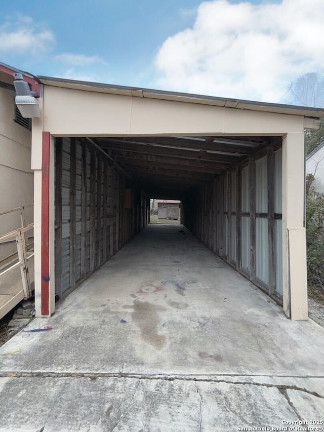 view of car parking featuring an attached carport