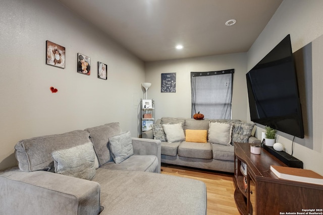 living room with recessed lighting and light wood finished floors