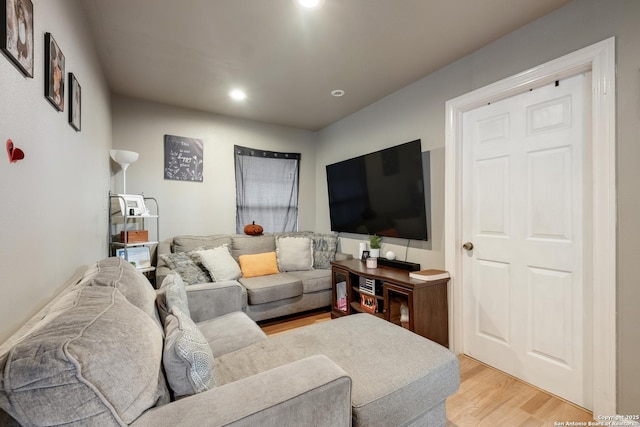 living area featuring recessed lighting and light wood-style floors