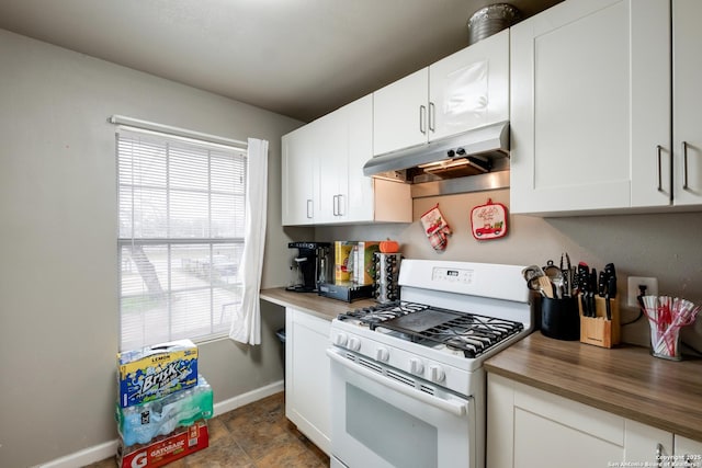 kitchen featuring gas range gas stove, wood counters, white cabinetry, and under cabinet range hood