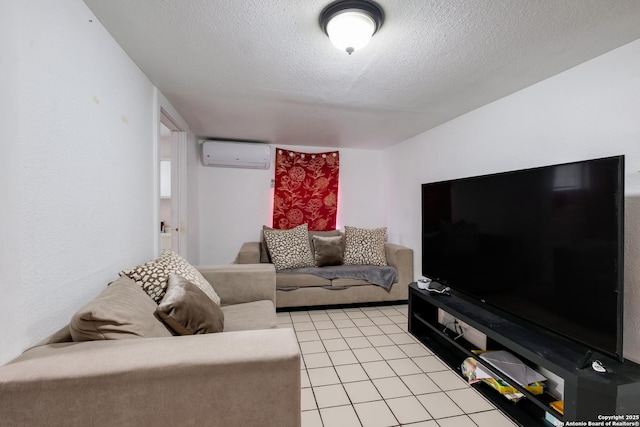 living area featuring light tile patterned floors, a textured ceiling, and a wall mounted AC