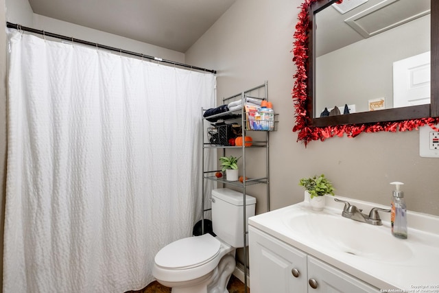 full bathroom with toilet and vanity