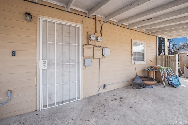 entrance to property featuring a patio area