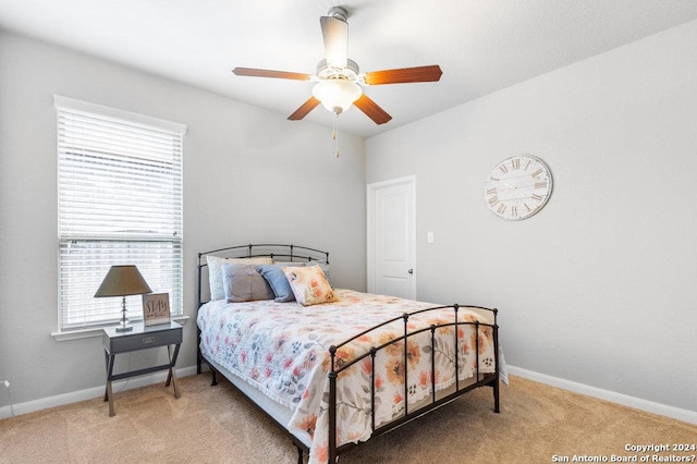 bedroom featuring carpet, ceiling fan, and baseboards