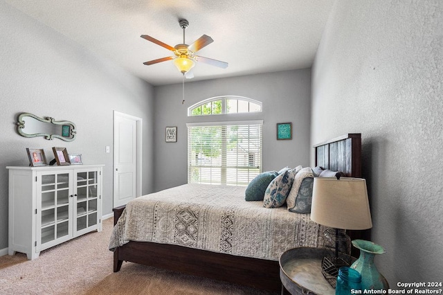 carpeted bedroom featuring ceiling fan and baseboards