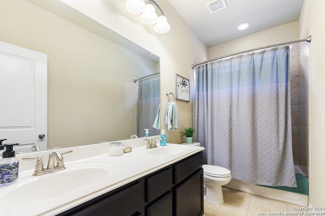 full bathroom featuring shower / tub combo, visible vents, a sink, and tile patterned floors