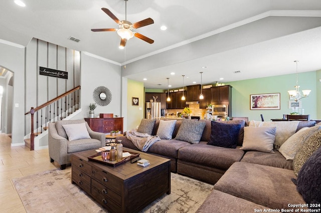 living area with arched walkways, crown molding, recessed lighting, stairway, and ceiling fan with notable chandelier