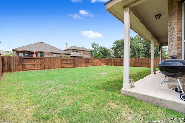 view of yard featuring a patio area and a fenced backyard