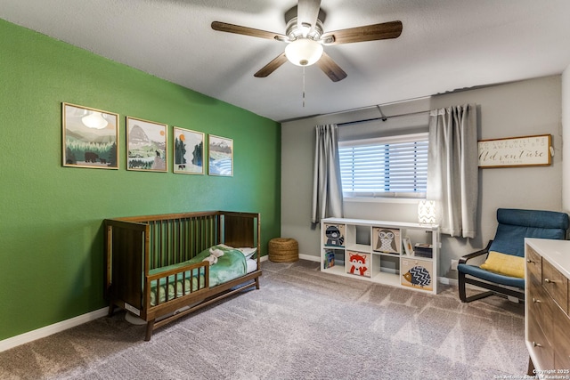 carpeted bedroom featuring ceiling fan and baseboards