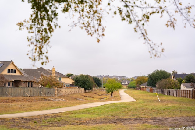 view of yard featuring a residential view and fence