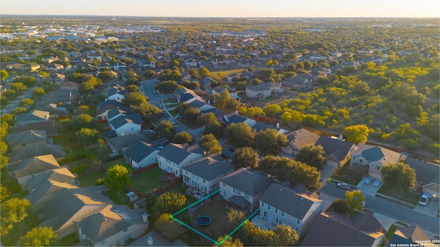 birds eye view of property with a residential view