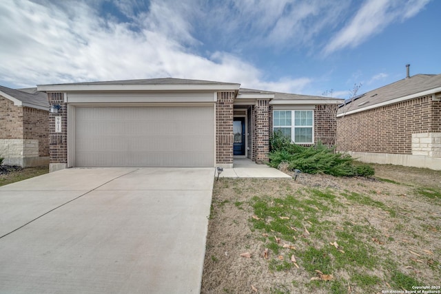 ranch-style home with a garage, driveway, and brick siding